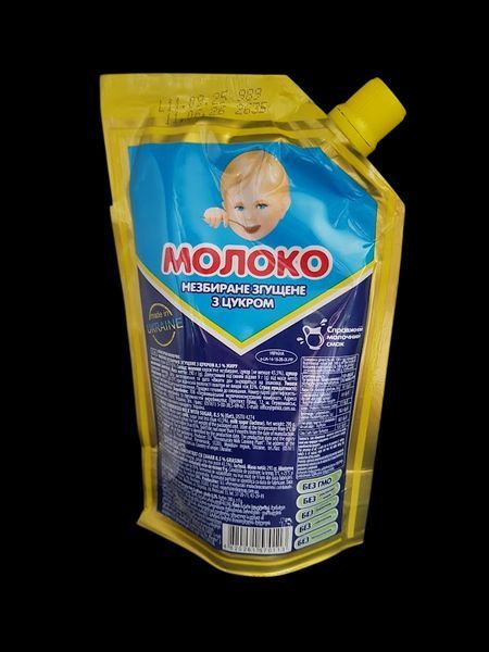 Згущене молоко Першомайський МКК цільне з цукром ДСТУ 290 дой-пак 341010 фото